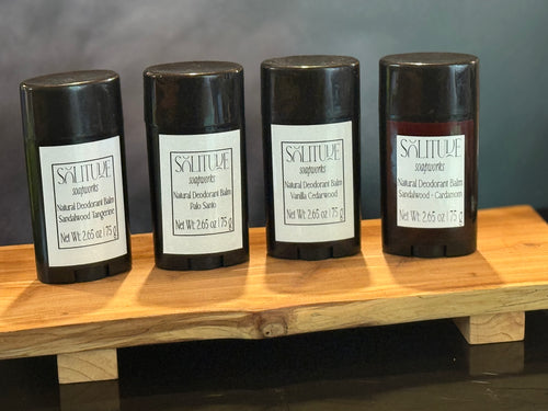 Black deodorant tubes with white labels