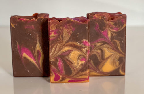retangular Brown soap with gold and bright pink swirls