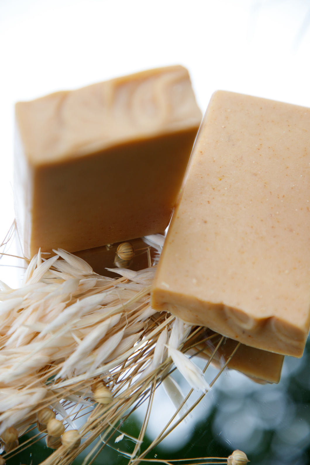 Sunstone Goat Milk Soap bar, marbled in golden turmeric hues, scented with saffron and cedar, artisan-made with a creamy lather
